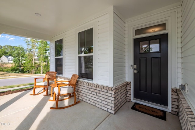 doorway to property with a porch