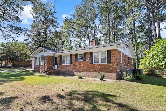 single story home with a chimney, brick siding, crawl space, and a front yard