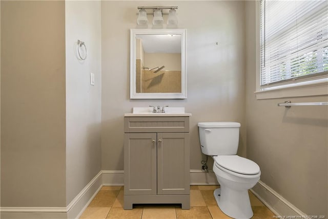 full bathroom with tile patterned flooring, vanity, toilet, and baseboards