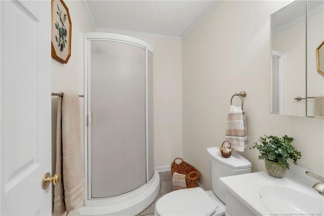83 Pine Lake Dr, Whispering Pines, NC 28327 - bathroom with vanity, toilet, a stall shower, and ornamental molding