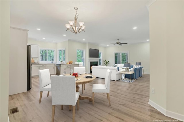 45 Martin Dr, Whispering Pines, NC 28327 - dining room featuring plenty of natural light, light wood-style floors, a chandelier, and recessed lighting