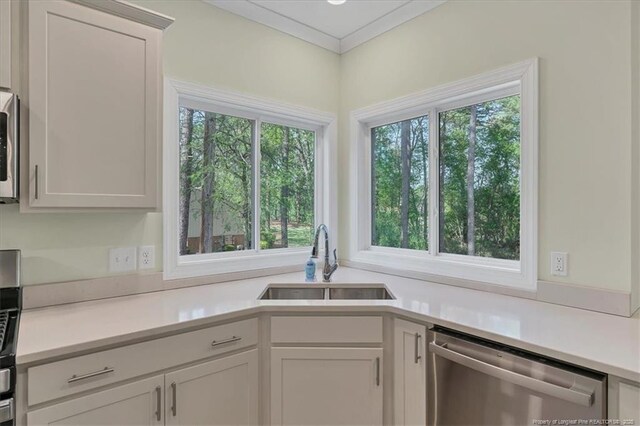 45 Martin Dr, Whispering Pines, NC 28327 - kitchen with dishwasher, light countertops, and white cabinetry