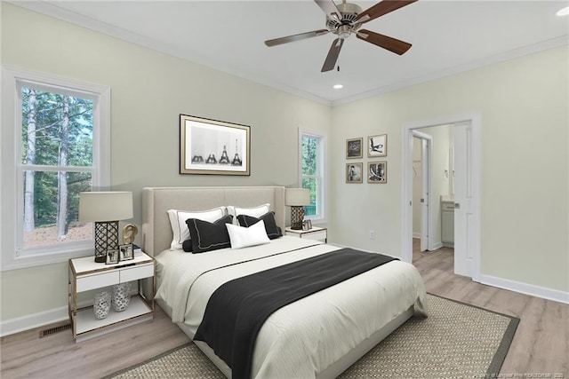 45 Martin Dr, Whispering Pines, NC 28327 - bedroom with multiple windows, light wood finished floors, ornamental molding, recessed lighting, and a ceiling fan