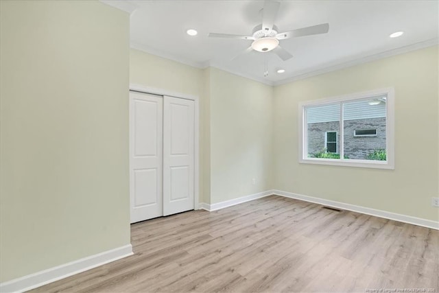 45 Martin Dr, Whispering Pines, NC 28327 - unfurnished bedroom with wood finished floors, a closet, ornamental molding, a ceiling fan, and recessed lighting