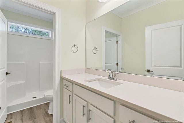 45 Martin Dr, Whispering Pines, NC 28327 - bathroom featuring vanity, wood finished floors, a shower, and crown molding