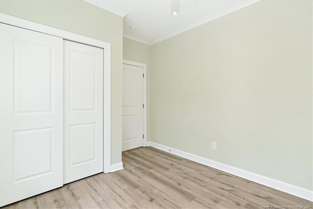 45 Martin Dr, Whispering Pines, NC 28327 - unfurnished bedroom featuring light wood-style flooring and a closet