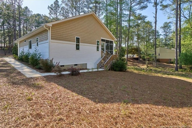 45 Martin Dr, Whispering Pines, NC 28327 - view of home's exterior featuring crawl space and stairway