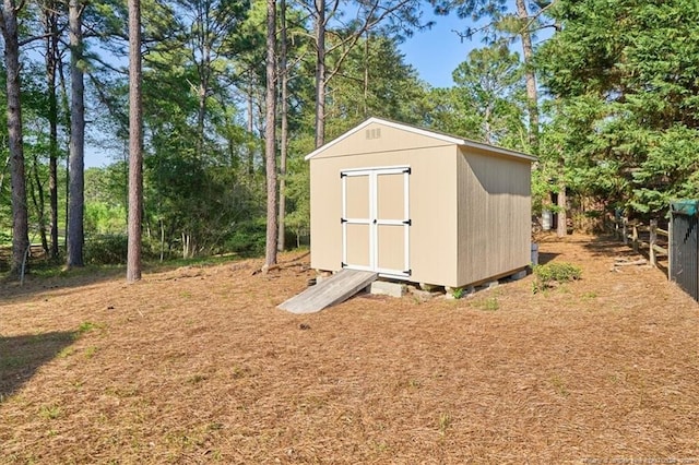 45 Martin Dr, Whispering Pines, NC 28327 - view of shed featuring view of wooded area