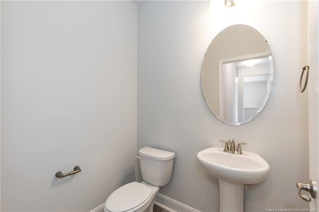 bathroom with a sink and toilet