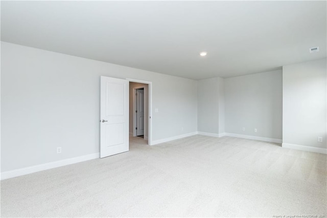 unfurnished room with baseboards, visible vents, recessed lighting, and light colored carpet