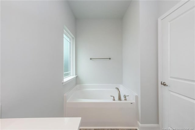full bath with a garden tub
