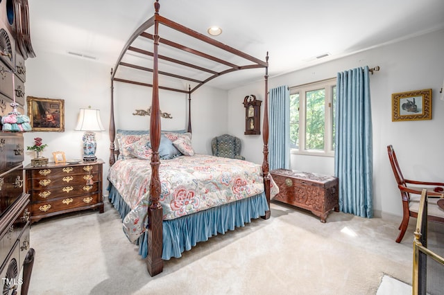 bedroom with visible vents and carpet flooring