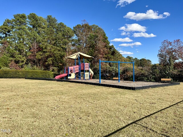 community playground featuring a lawn