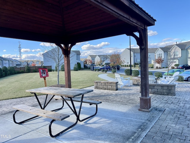 view of patio / terrace with a gazebo and a residential view