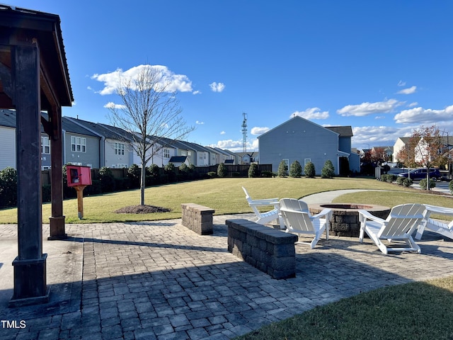 view of patio with a residential view and an outdoor fire pit
