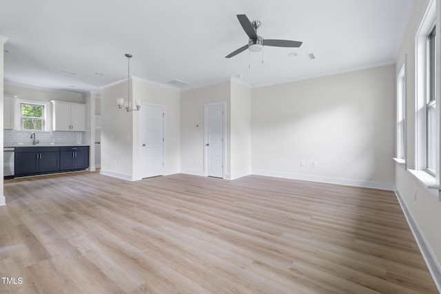 1448A Maplewood Dr, Durham, NC 27704 - unfurnished living room with a chandelier, light wood finished floors, ceiling fan, baseboards, and ornamental molding