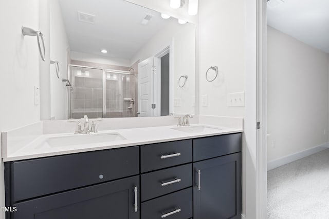 1448A Maplewood Dr, Durham, NC 27704 - bathroom featuring a shower stall, double vanity, baseboards, and recessed lighting