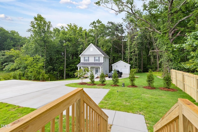 1448A Maplewood Dr, Durham, NC 27704 - view of yard featuring an outdoor structure, covered porch, and a forest view