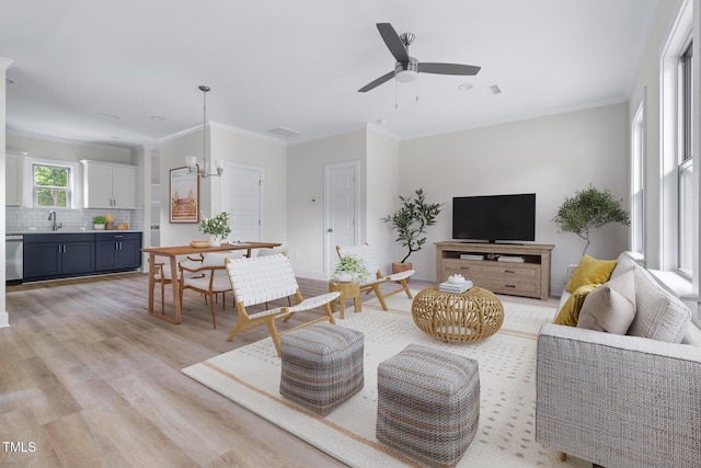 1448A Maplewood Dr, Durham, NC 27704 - living room featuring light wood-type flooring, a ceiling fan, and ornamental molding