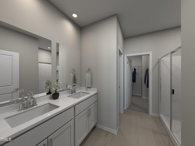 3709 Rosebush Dr, Zebulon, NC 27597 - full bathroom with double vanity, a stall shower, a walk in closet, and recessed lighting
