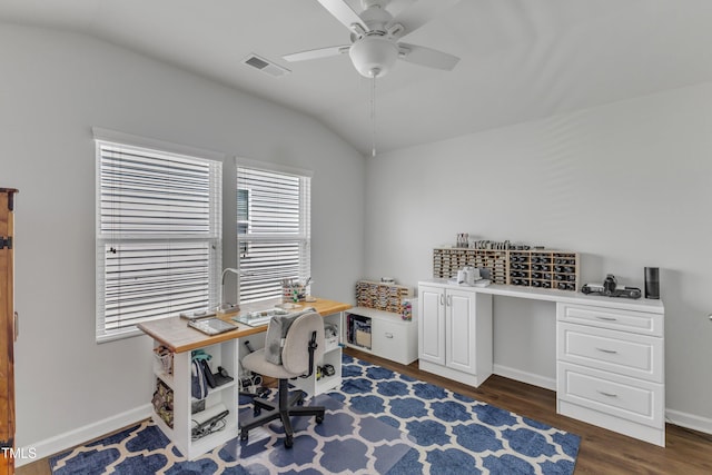 home office featuring vaulted ceiling, ceiling fan, dark wood-style floors, and baseboards
