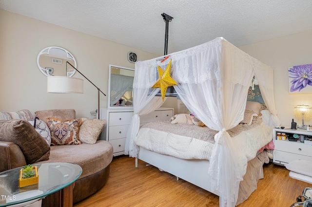 bedroom featuring wood finished floors