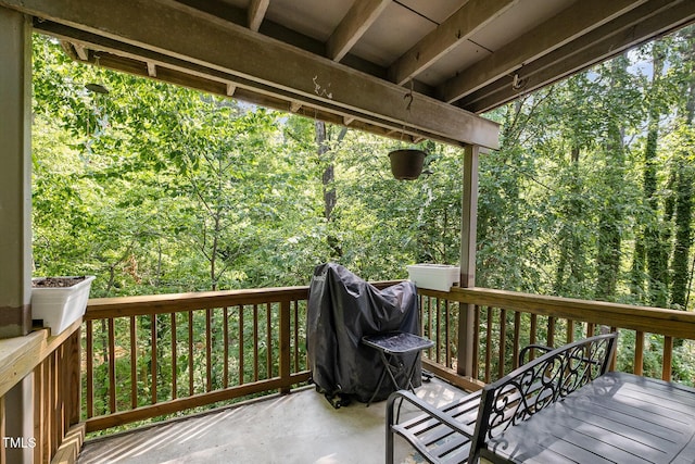 wooden deck featuring a wooded view