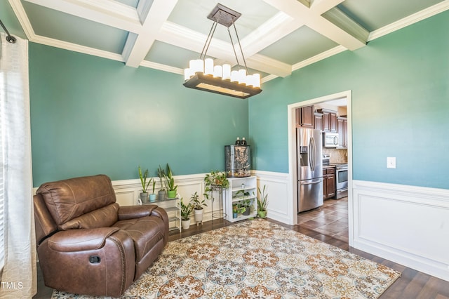 sitting room featuring wainscoting, beam ceiling, a notable chandelier, and coffered ceiling