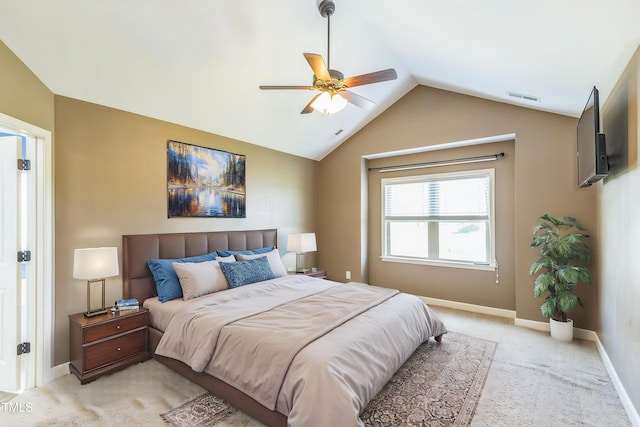 bedroom featuring lofted ceiling, visible vents, baseboards, light colored carpet, and ceiling fan