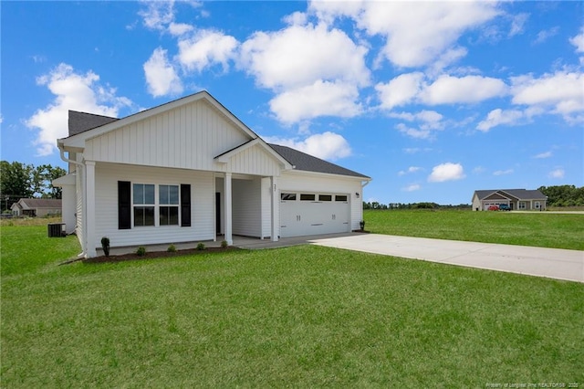 5566 Philippi Church Rd, Raeford, NC 28376 - view of front of home with driveway, a garage, a front lawn, and cooling unit