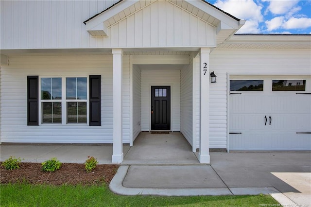 5566 Philippi Church Rd, Raeford, NC 28376 - doorway to property featuring a garage and covered porch