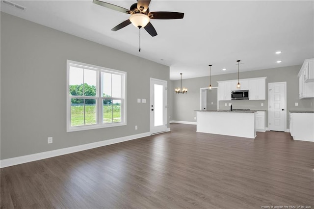 5566 Philippi Church Rd, Raeford, NC 28376 - unfurnished living room featuring recessed lighting, dark wood-style floors, a ceiling fan, baseboards, and a chandelier