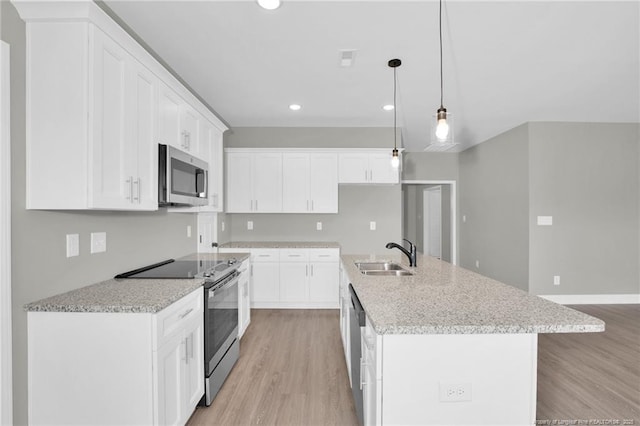 5566 Philippi Church Rd, Raeford, NC 28376 - kitchen featuring stainless steel appliances, a sink, light wood-type flooring, recessed lighting, and white cabinetry