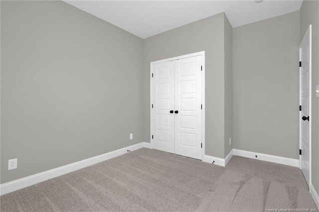 5566 Philippi Church Rd, Raeford, NC 28376 - unfurnished bedroom featuring carpet, baseboards, and a closet