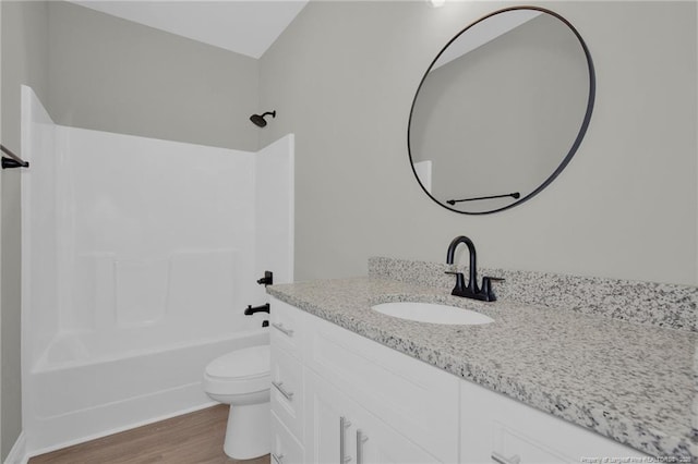 5566 Philippi Church Rd, Raeford, NC 28376 - bathroom featuring vanity, toilet, wood finished floors, and  shower combination