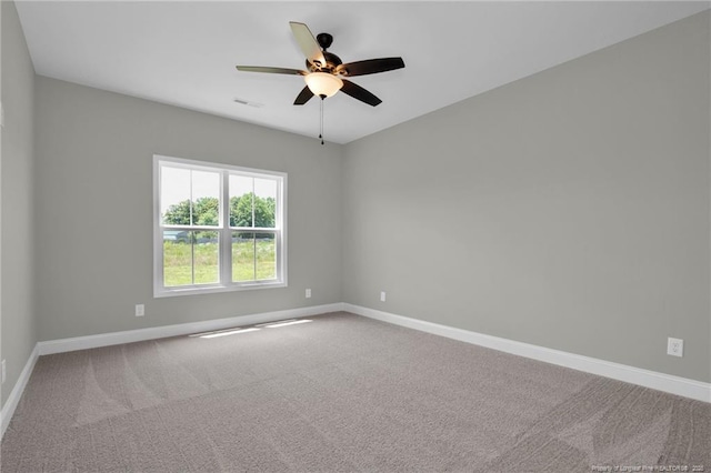 5566 Philippi Church Rd, Raeford, NC 28376 - spare room with baseboards, carpet floors, and a ceiling fan