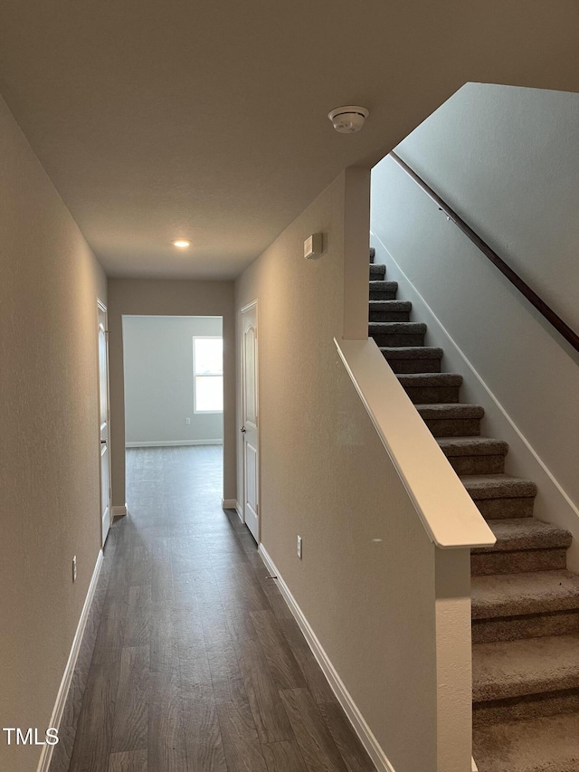 209 Lillian Ct, Roxboro, NC 27573 - stairs featuring wood finished floors and baseboards