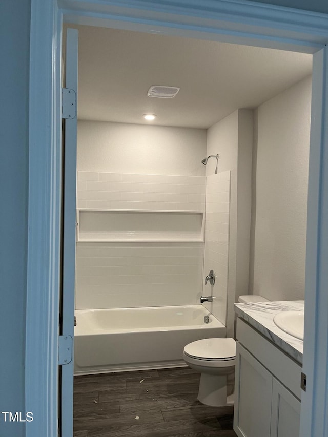 209 Lillian Ct, Roxboro, NC 27573 - full bath featuring washtub / shower combination, wood finished floors, toilet, and vanity