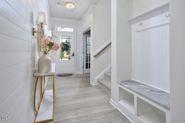 490 Mallard Loop Dr, Clayton, NC 27527 - entrance foyer with baseboards, light wood-style floors, stairs, and ornamental molding