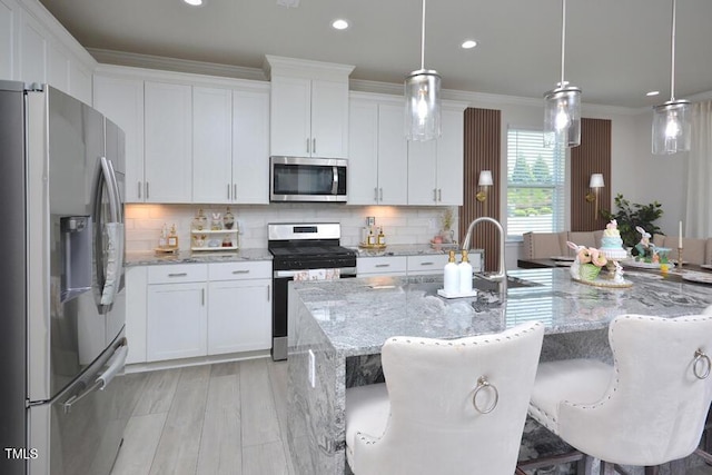 490 Mallard Loop Dr, Clayton, NC 27527 - kitchen featuring white cabinets and appliances with stainless steel finishes