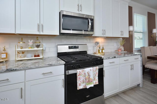 490 Mallard Loop Dr, Clayton, NC 27527 - kitchen featuring white cabinets, stainless steel appliances, backsplash, crown molding, and light stone countertops