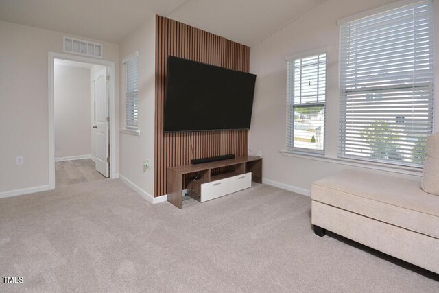 490 Mallard Loop Dr, Clayton, NC 27527 - unfurnished living room featuring carpet floors, lofted ceiling, visible vents, and baseboards