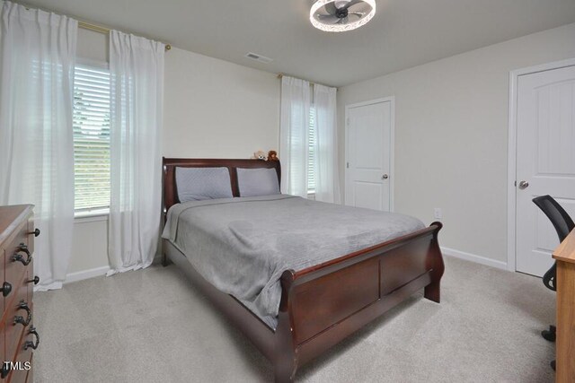 490 Mallard Loop Dr, Clayton, NC 27527 - bedroom featuring visible vents, baseboards, and light carpet