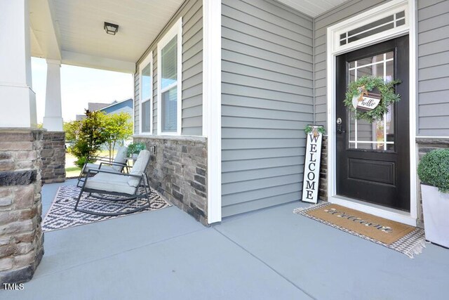 490 Mallard Loop Dr, Clayton, NC 27527 - entrance to property featuring a porch and stone siding