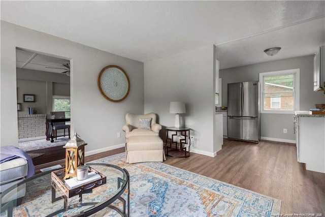 413 Lincoln Mckay Dr, Lillington, NC 27546 - living area featuring baseboards and wood finished floors