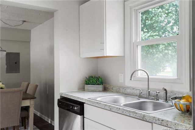 413 Lincoln Mckay Dr, Lillington, NC 27546 - kitchen with stainless steel dishwasher, white cabinetry, a sink, and electric panel