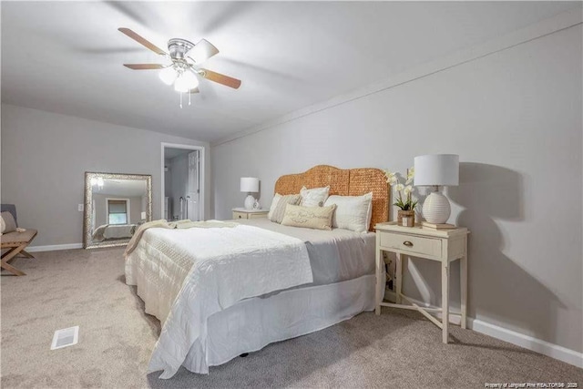 413 Lincoln Mckay Dr, Lillington, NC 27546 - carpeted bedroom with baseboards, a ceiling fan, and visible vents