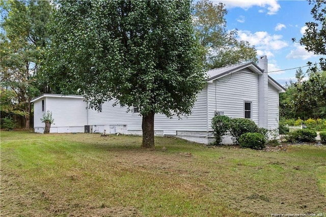 413 Lincoln Mckay Dr, Lillington, NC 27546 - view of property exterior with a lawn and a chimney
