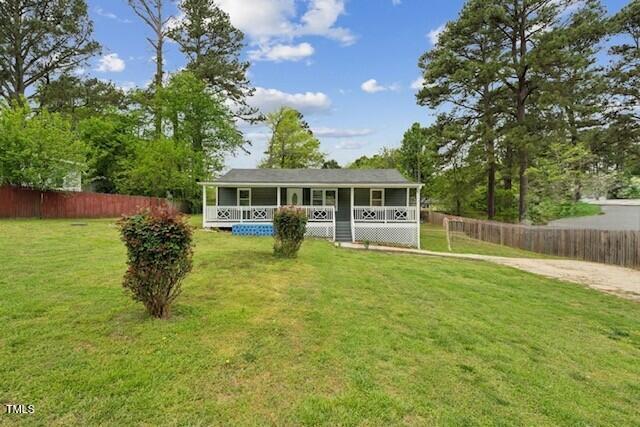 423 Orange Heights Rd, Hillsborough, NC 27278 - rear view of property with a yard, covered porch, and fence