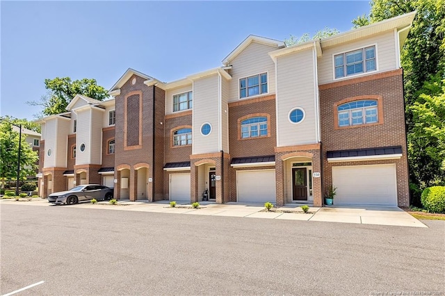 234 Hugh Shelton Loop, Fayetteville, NC 28301 - townhome / multi-family property with brick siding and a garage